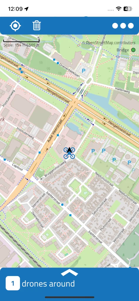 DroneScout map with one drone shown as a blue multicopter icon, the green Bridge dot at the top right, and '1 drones around' in the bottom bar